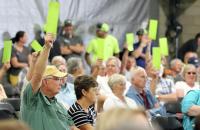 Member-owners vote on advisory motions at Crow Wing Power meeting. (Kelly Humphrey / Brainerd Dispatch)